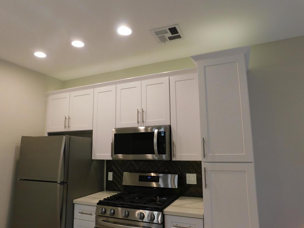 116 Maegan Place, Unit 11 Thousand Oaks, CA 91362 - Photo 13 of 35 a kitchen with a refrigerator and a stove top oven