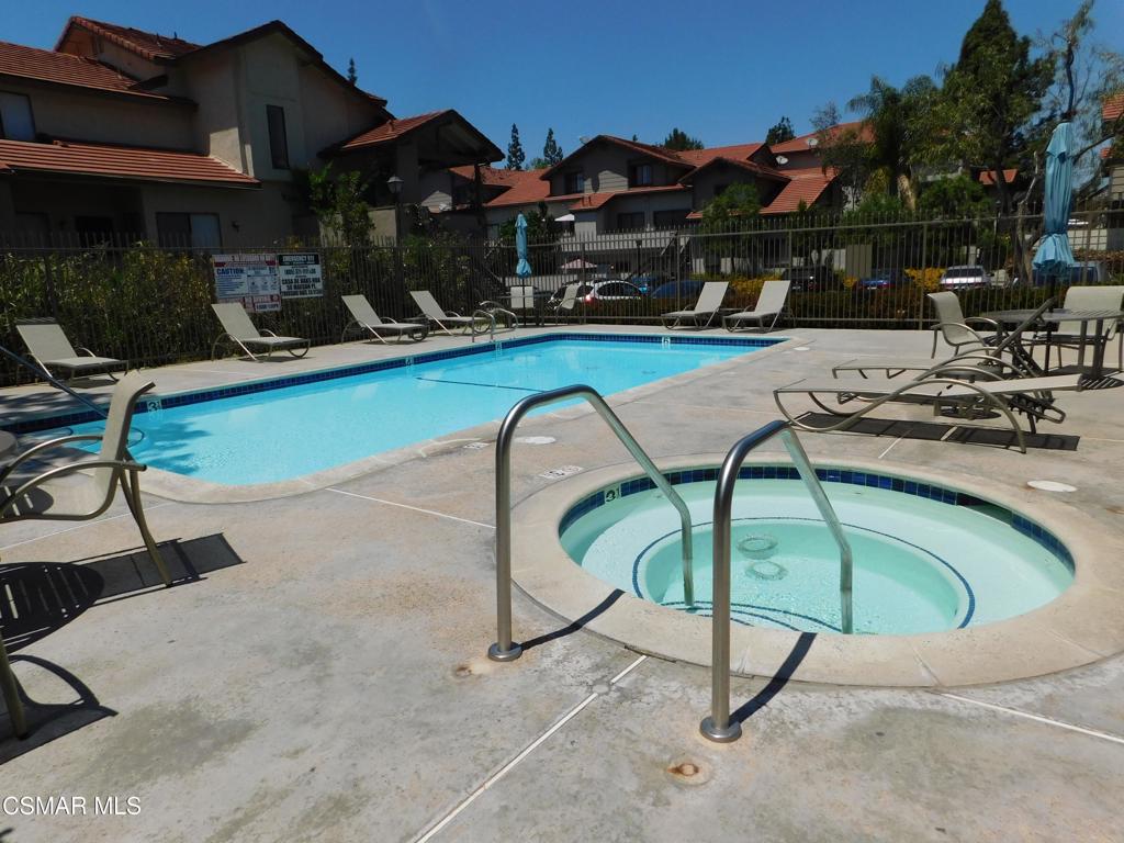 116 Maegan Place, Unit 11 Thousand Oaks, CA 91362 - Photo 34 of 35 a swimming pool with outdoor seating and yard