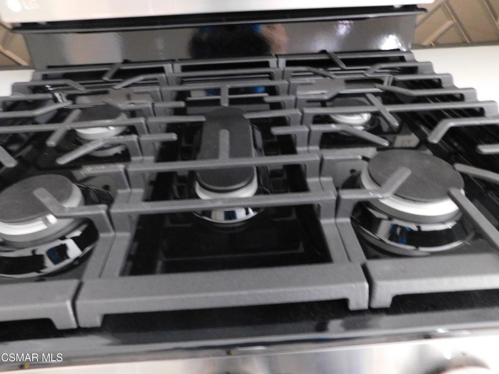 116 Maegan Place, Unit 11 Thousand Oaks, CA 91362 - Photo 9 of 35 a stove top oven sitting inside of a kitchen