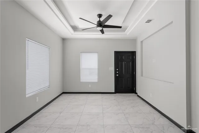 a view of an empty room with a window