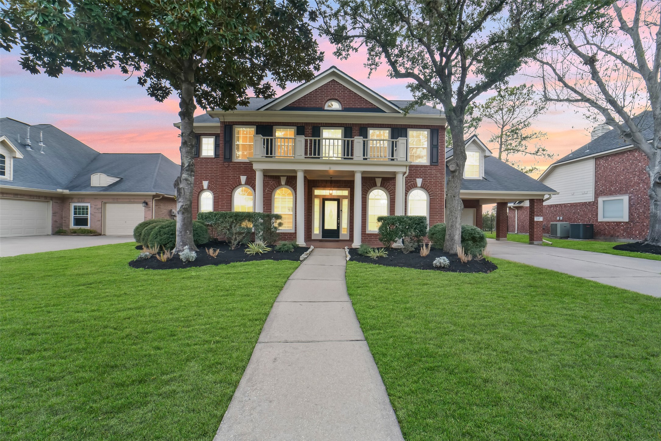 24403 Falcon Point Drive Katy, TX 77494 - Photo 1 of 32 Welcome to 24403 Falcon Point Dr. this beautiful home features stunning curb appeal, classic brick exterior, professional landscaping, and a welcoming entryway.