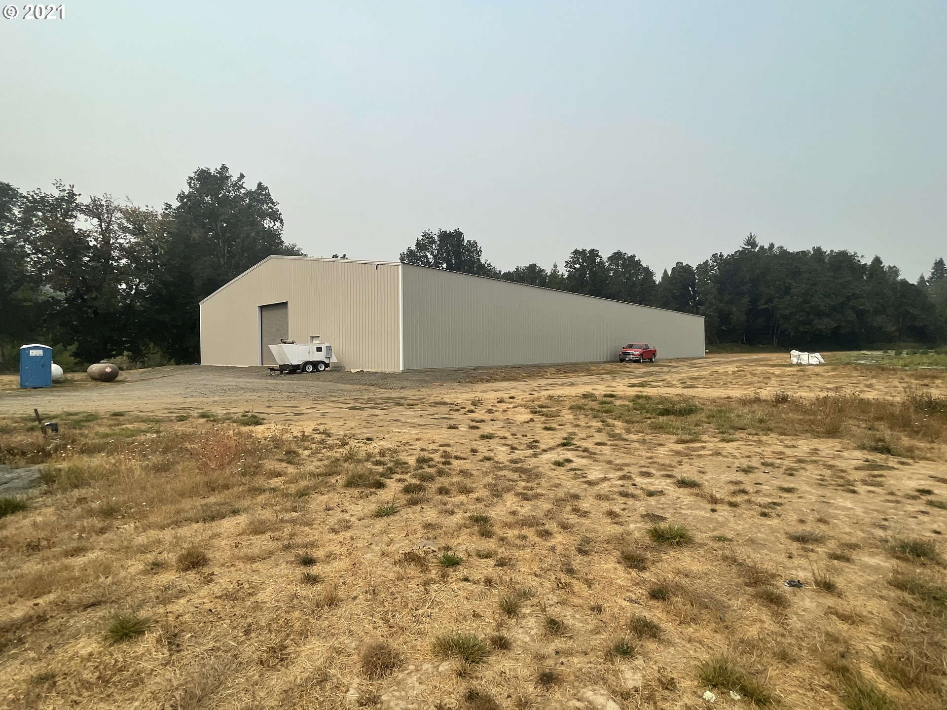 1021 Upper Camas Road Camas Valley, OR 97416 - Photo 15 of 27 a view of a white house with a yard