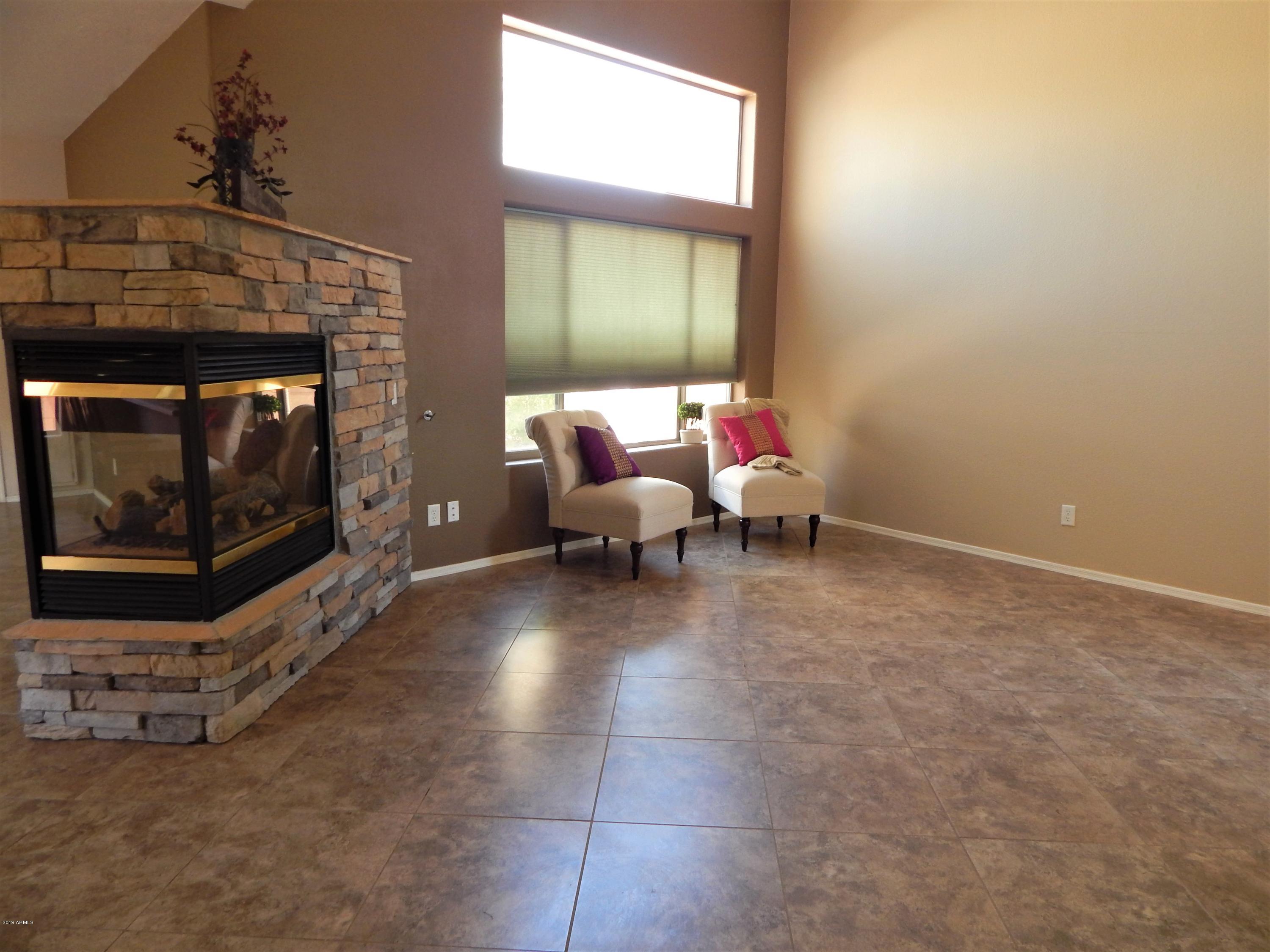 4008 East Ironhorse Road Gilbert, AZ 85297 - Photo 2 of 23 Living Room & 2 Way Fireplace