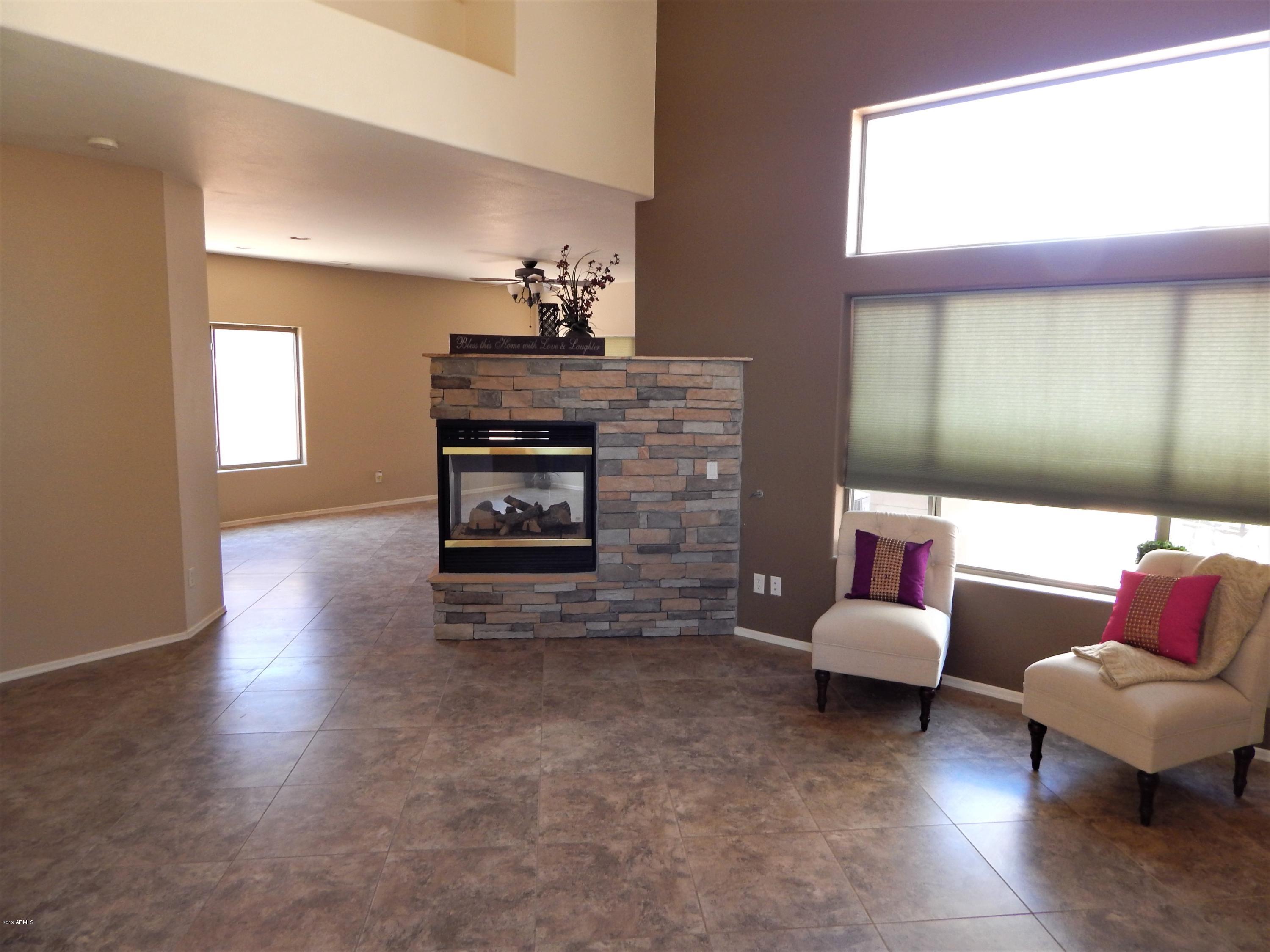 4008 East Ironhorse Road Gilbert, AZ 85297 - Photo 3 of 23 Living Room & 2 Way Fireplace 2
