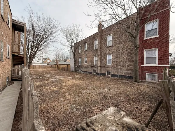 a pathway of a house with a yard