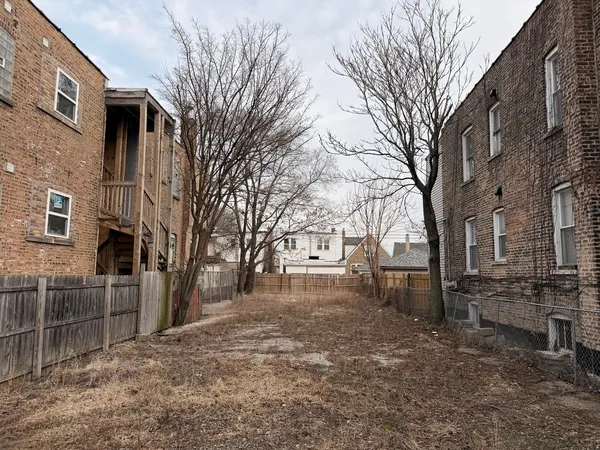 a view of a building with a yard