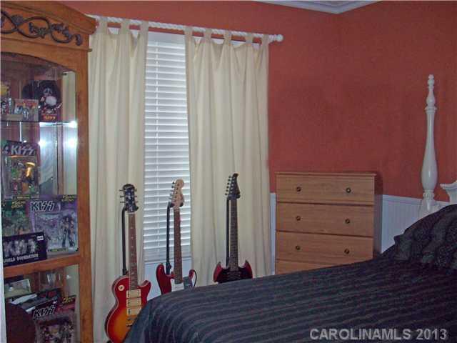 8027 Trotter Road Charlotte, NC 28216 - Photo 10 of 11 a bed room with a bed and a closet