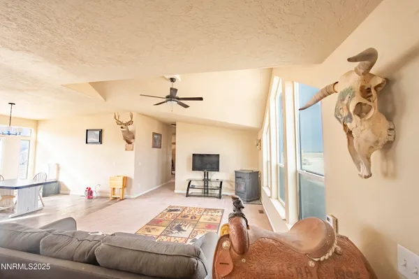 a bedroom with furniture and a flat screen tv