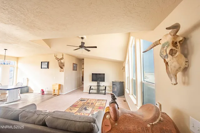 a bedroom with furniture and a flat screen tv