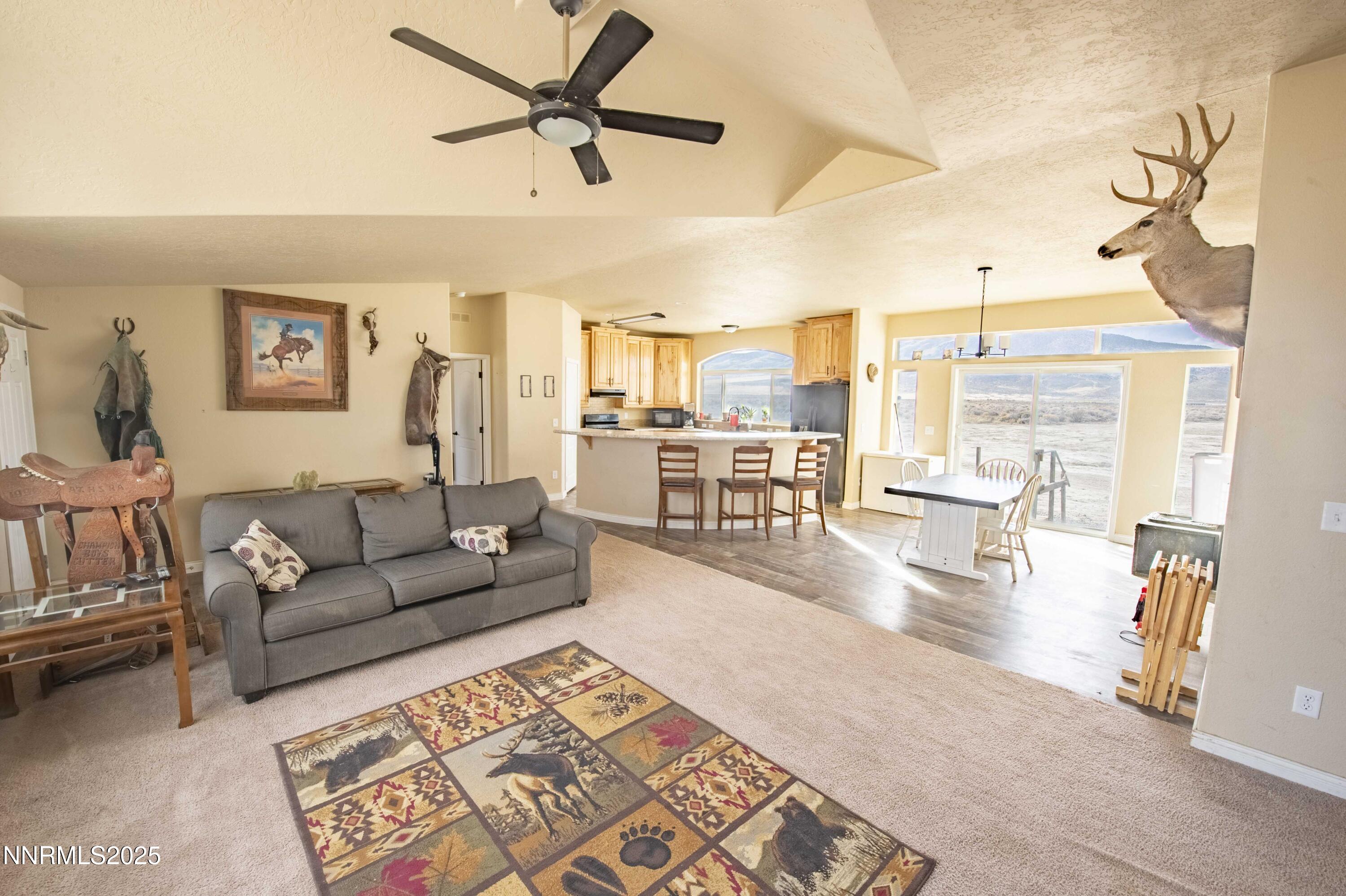 3139 Muddy Road Winnemucca, NV 89445 - Photo 11 of 46 a living room with furniture and a view of kitchen