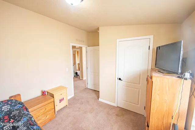 a view of a hallway with wooden shelves