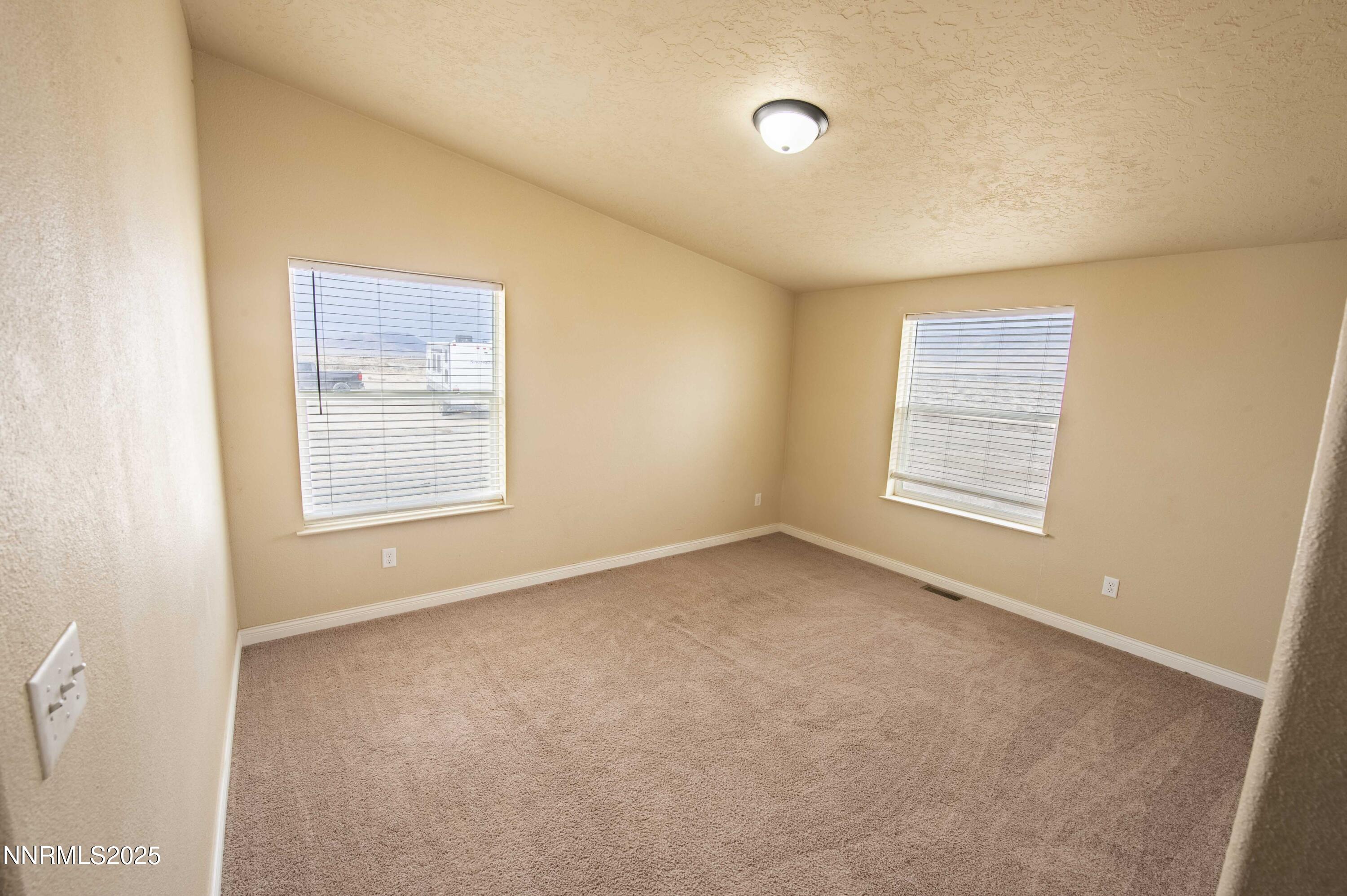 3139 Muddy Road Winnemucca, NV 89445 - Photo 19 of 46 an empty room with windows