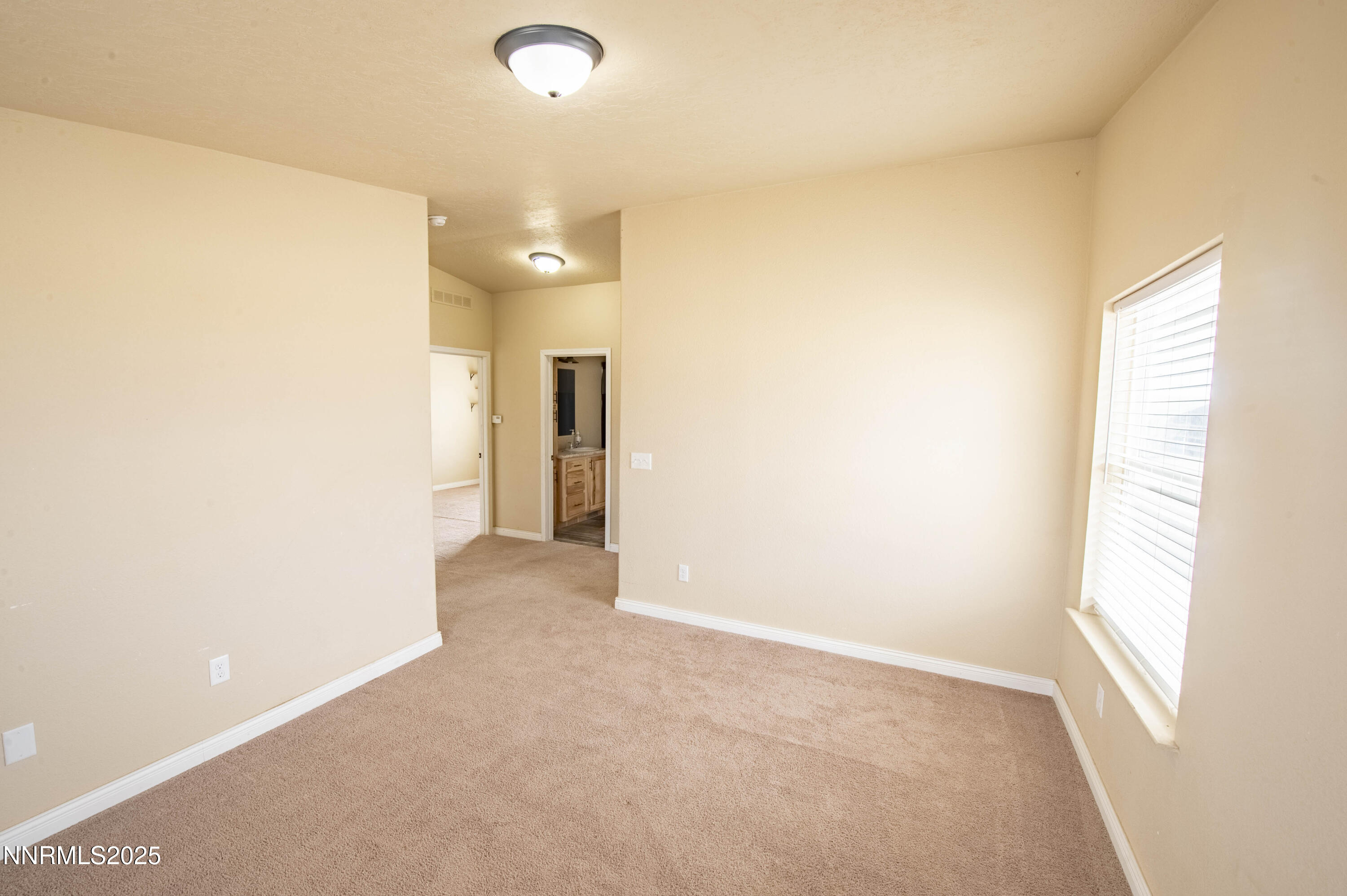3139 Muddy Road Winnemucca, NV 89445 - Photo 20 of 46 a view of a hallway with a window