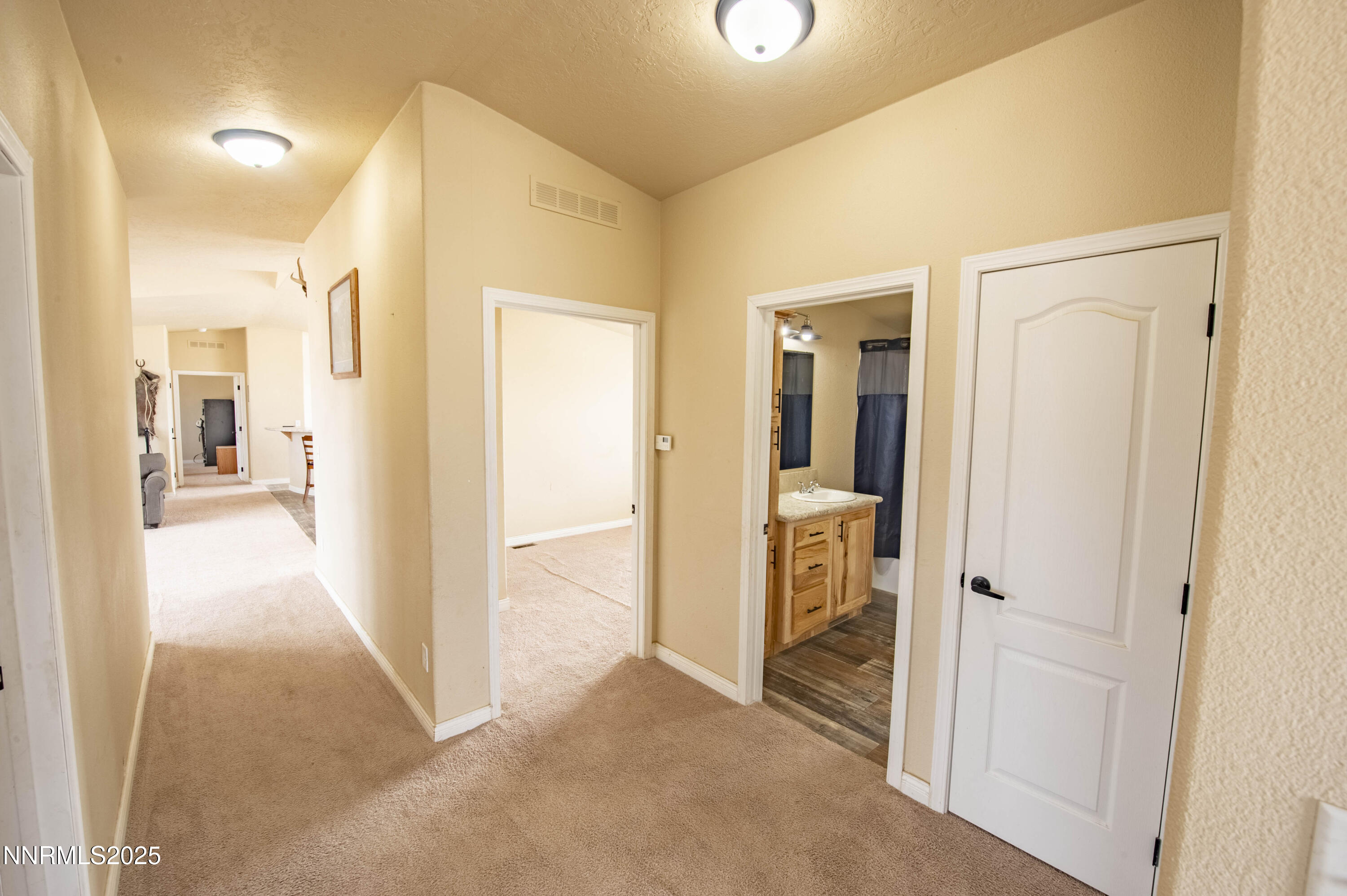 3139 Muddy Road Winnemucca, NV 89445 - Photo 21 of 46 a view of a hallway with wooden shelves