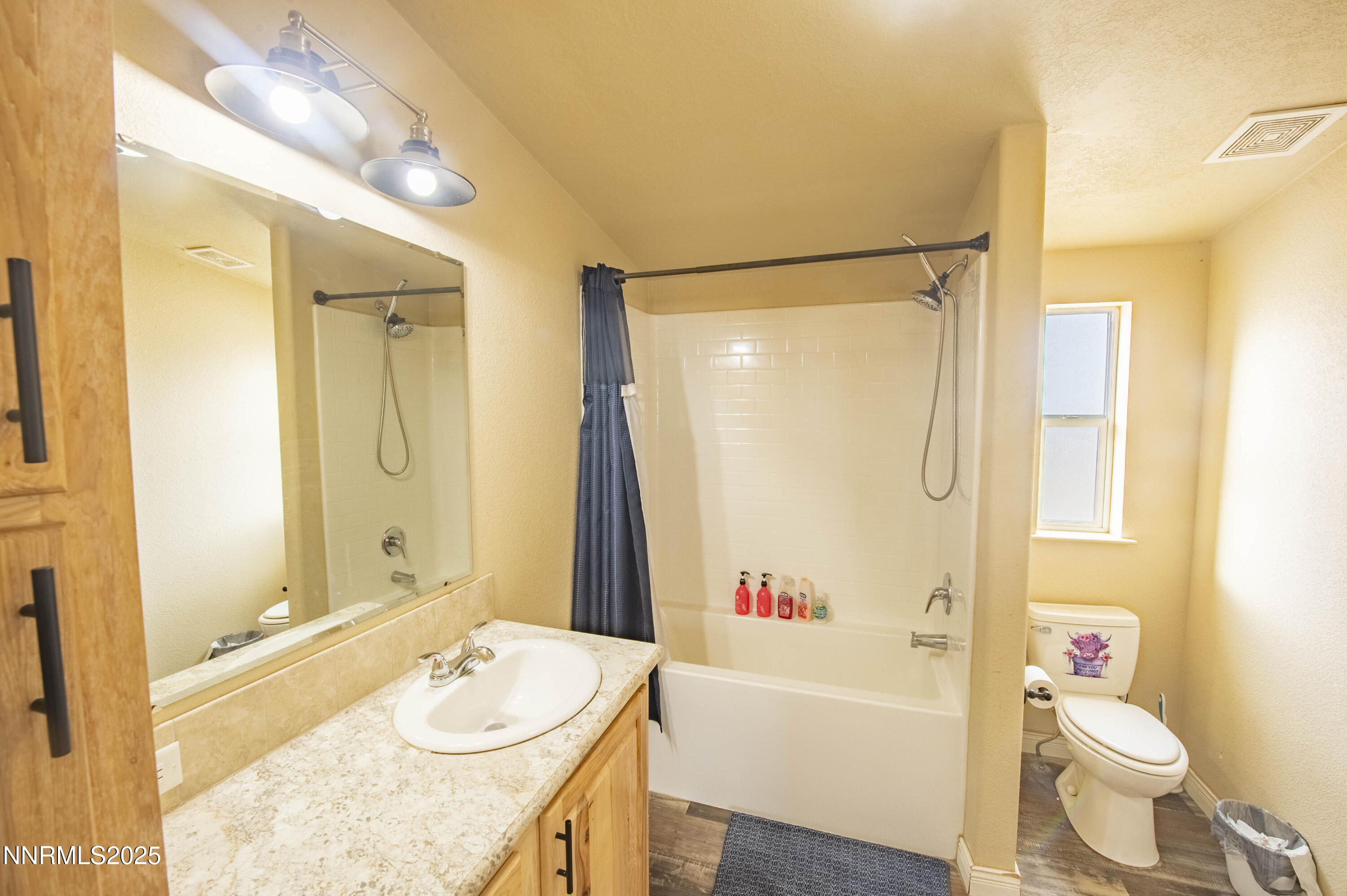 3139 Muddy Road Winnemucca, NV 89445 - Photo 22 of 46 a bathroom with a granite countertop sink toilet and shower