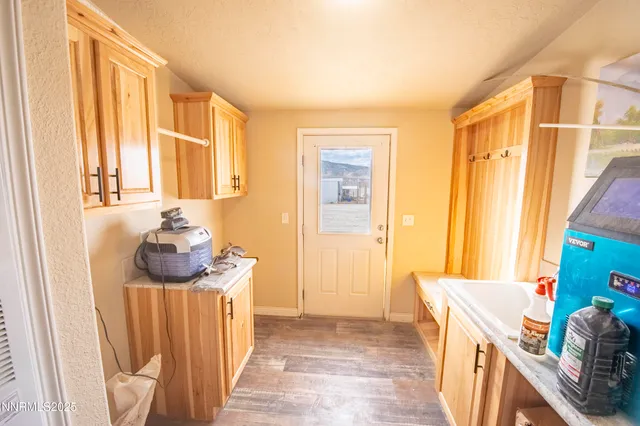 a bedroom with a bed a couch and dresser