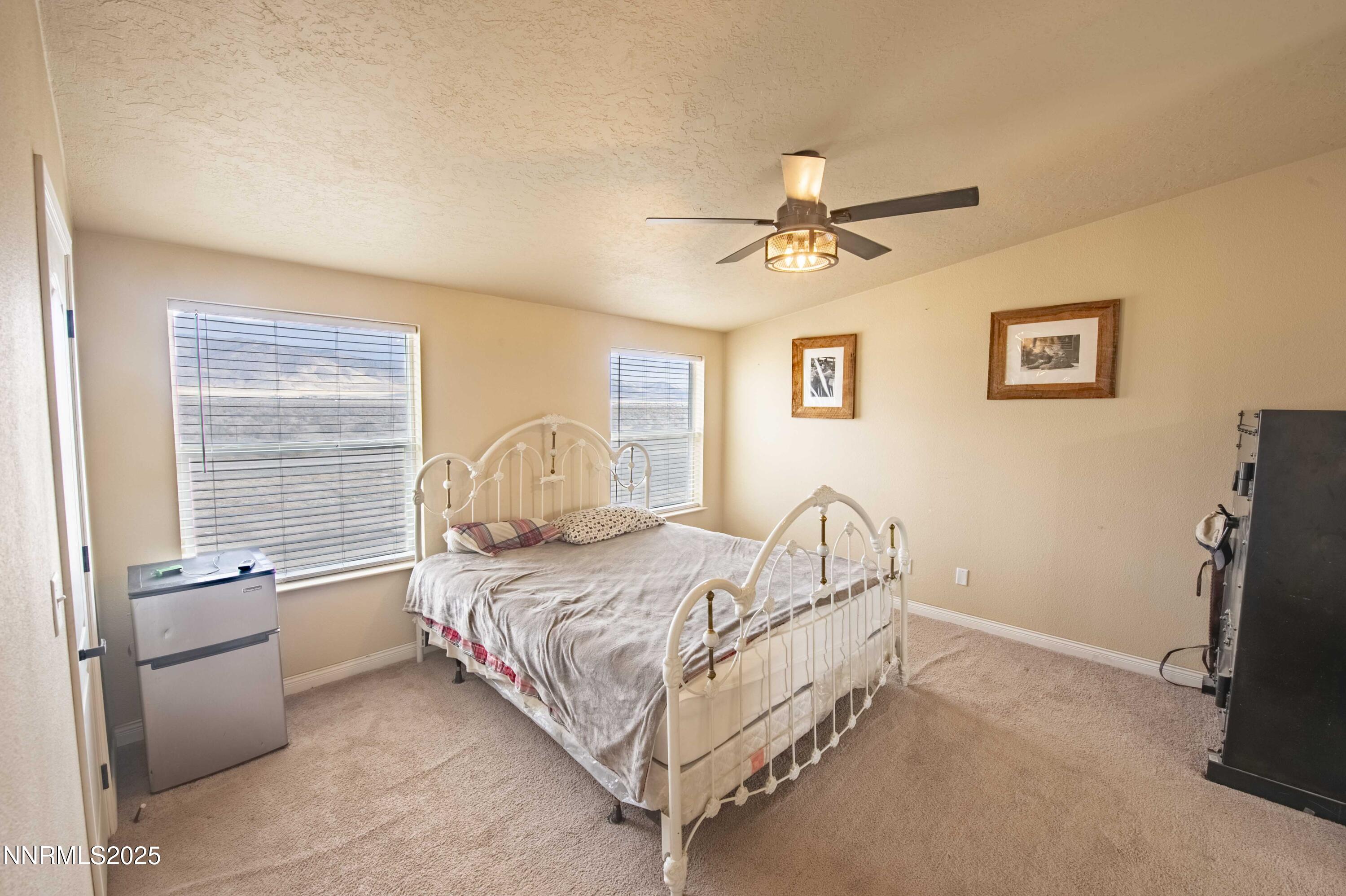 3139 Muddy Road Winnemucca, NV 89445 - Photo 28 of 46 a bedroom with a bed and a window