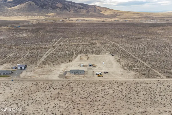 a view of a refrigerator with wooden floor