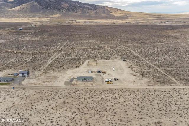 a view of a refrigerator with wooden floor