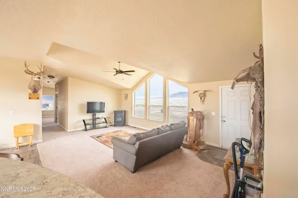 a spacious bathroom with a tub sink and a mirror