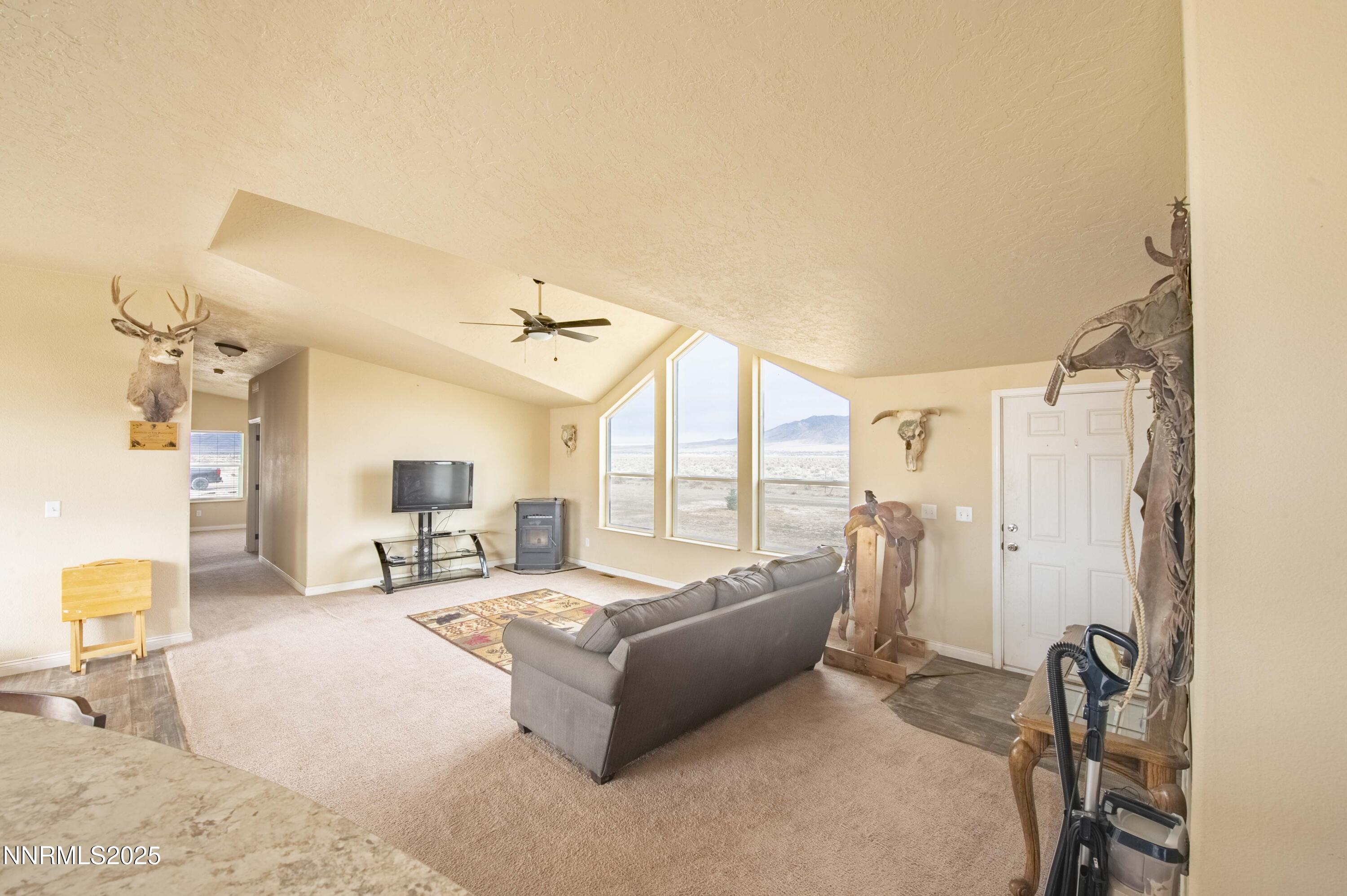 3139 Muddy Road Winnemucca, NV 89445 - Photo 9 of 46 a living room with furniture and a large window