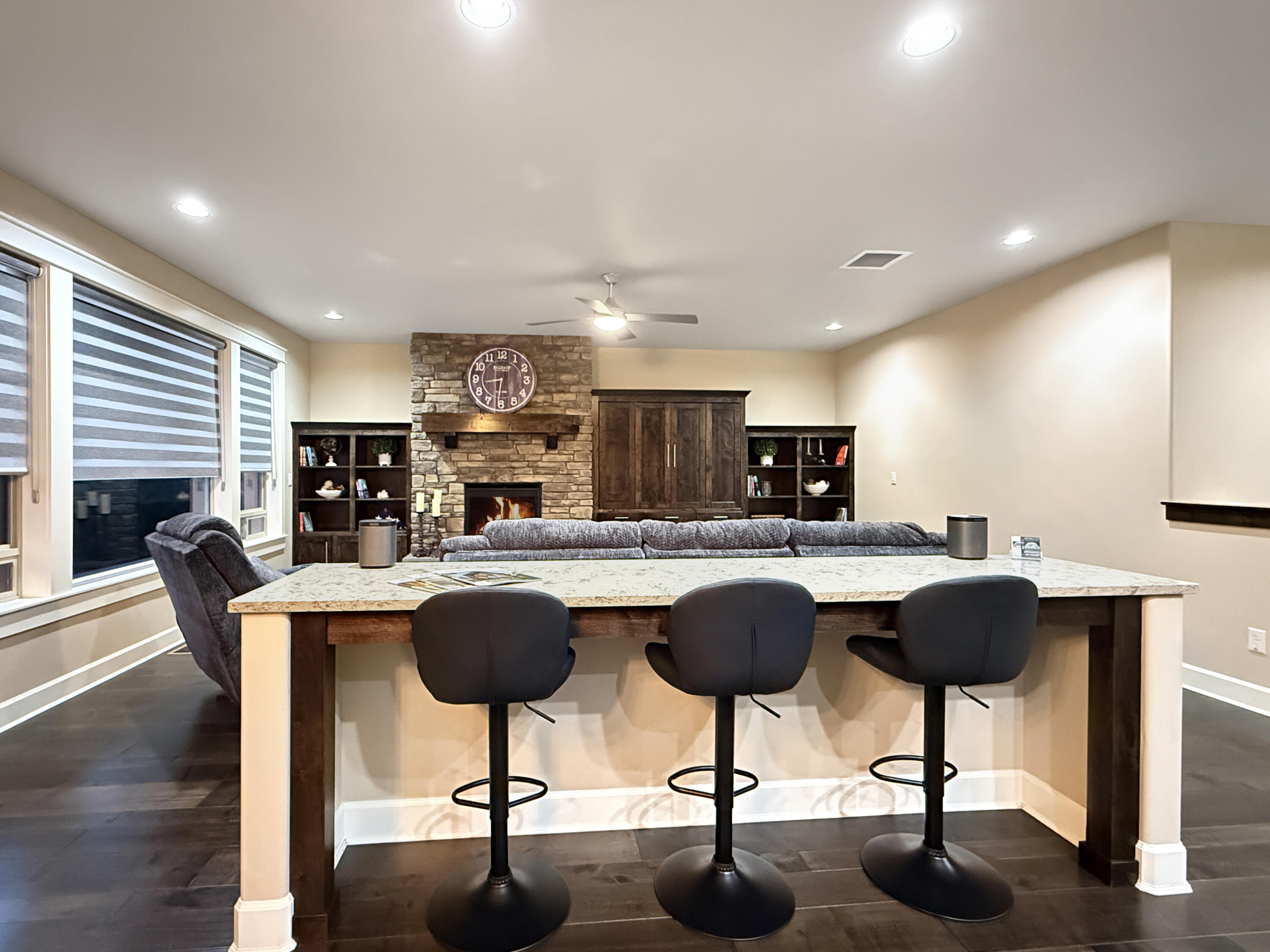 61072 Manhae Loop Bend, OR 97702 - Photo 7 of 63 a kitchen with stainless steel appliances kitchen island a table chairs in it and wooden floors