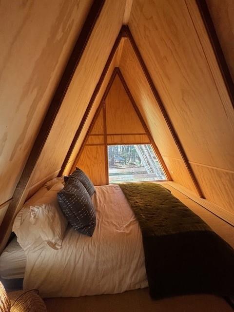 10 Beasore Road Bass Lake, CA 93604 - Photo 15 of 15 a bedroom with a bed and a window