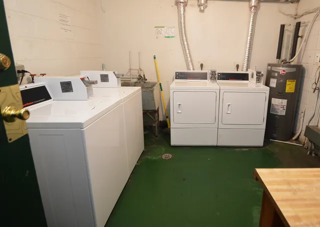 a view of kitchen and utility room with washer and dryer