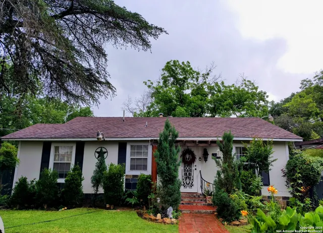 a view of a house with garden and plants