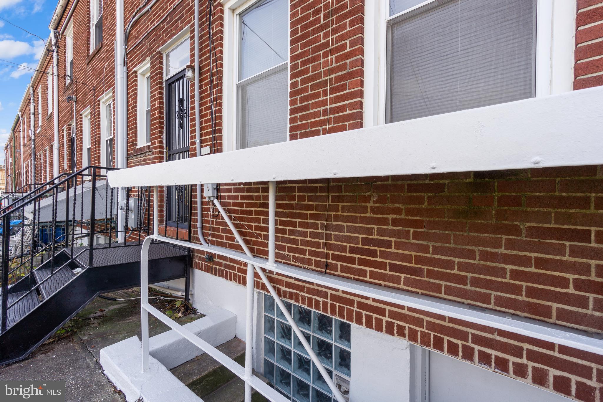 3572 Juneway, Unit 1 Baltimore, MD 21213 - Photo 19 of 23 a front view of a building with glass windows