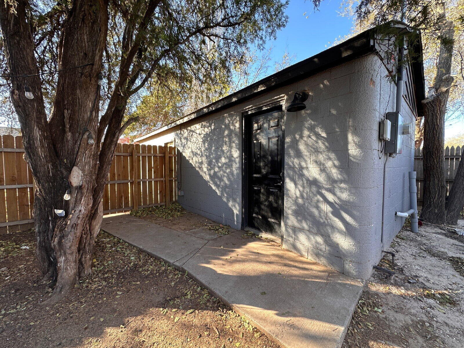 2622 32nd Street, Unit REAR Lubbock, TX 79410 - Photo 1 of 6 a view of backyard with tree
