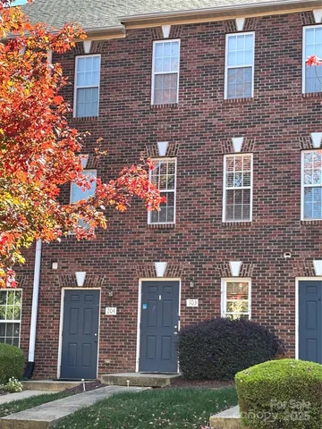 a front view of a house with yard