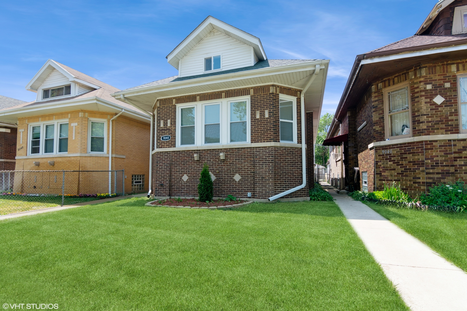 front view of a house with a yard