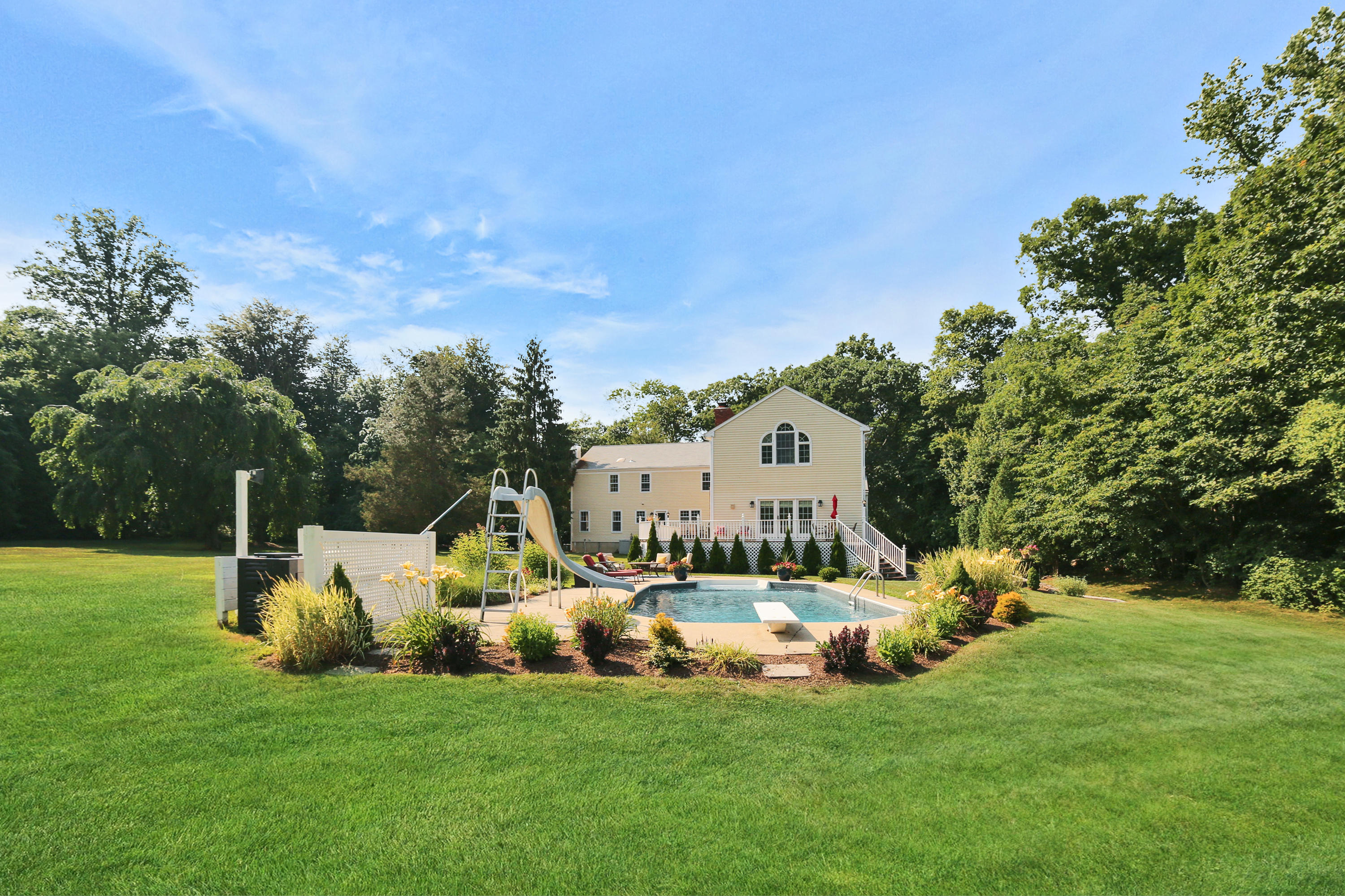48 Hoyt Farm Road New Canaan, CT 06840 - Photo 1 of 26 a view of a house with a yard and sitting area