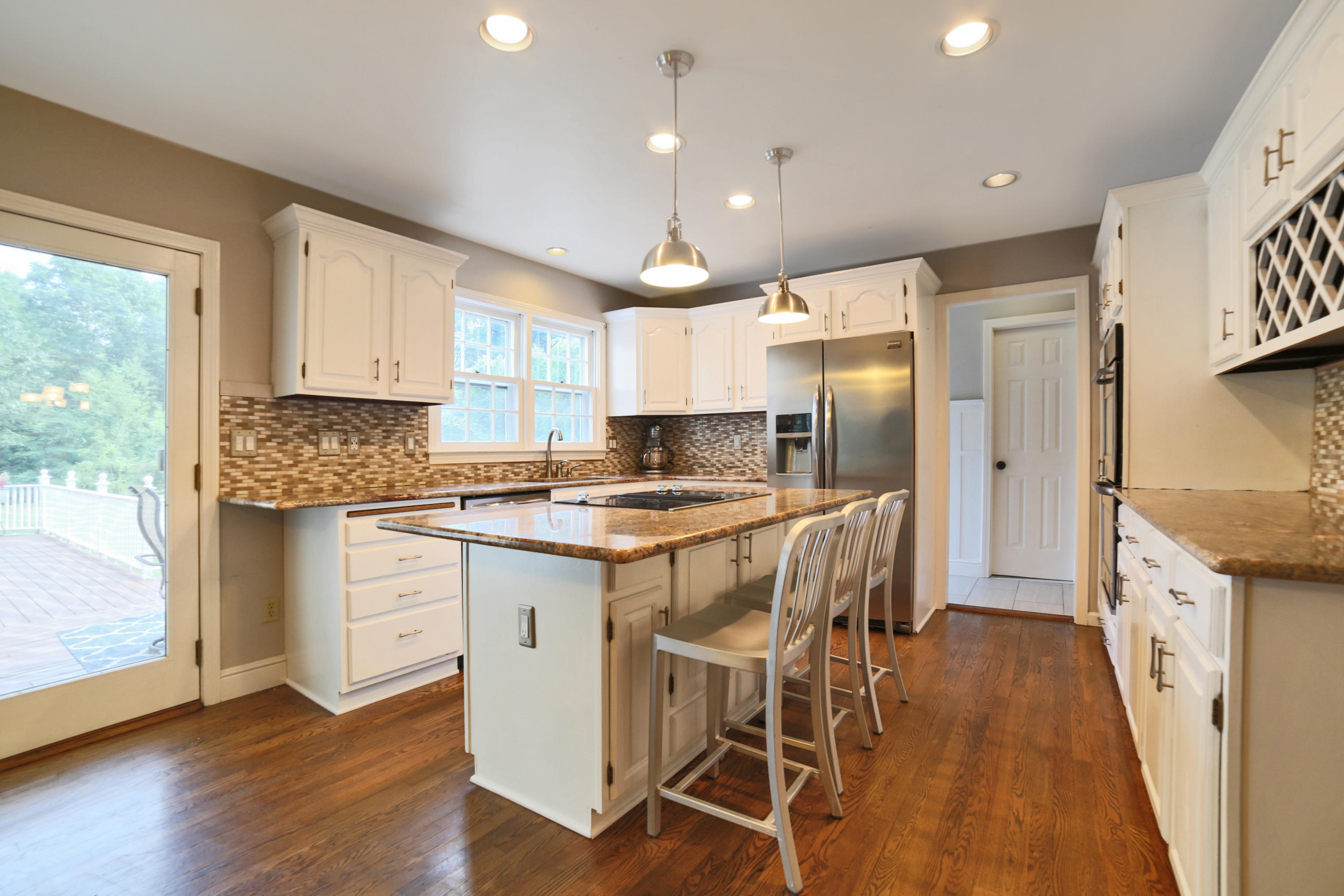 48 Hoyt Farm Road New Canaan, CT 06840 - Photo 12 of 26 a kitchen with granite countertop a stove a sink a refrigerator and a refrigerator
