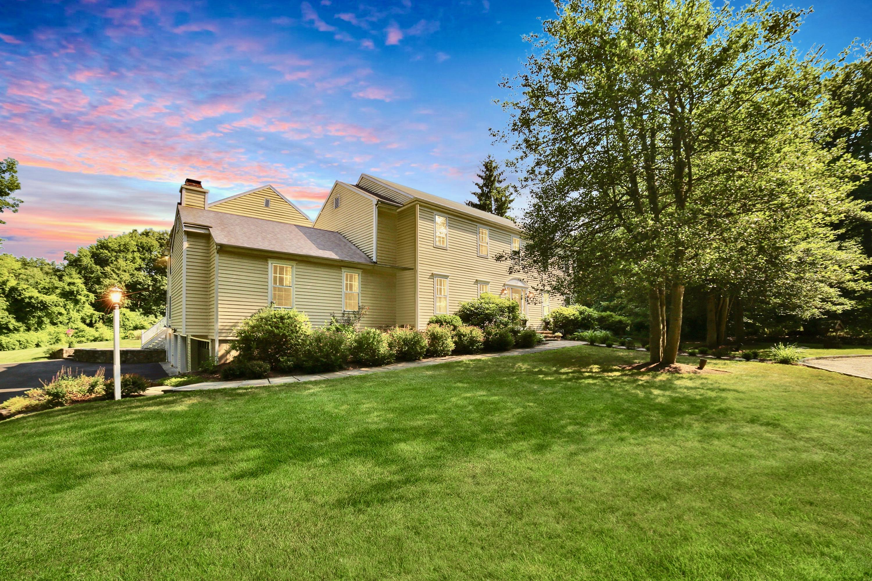 48 Hoyt Farm Road New Canaan, CT 06840 - Photo 2 of 26 a view of a house with a backyard