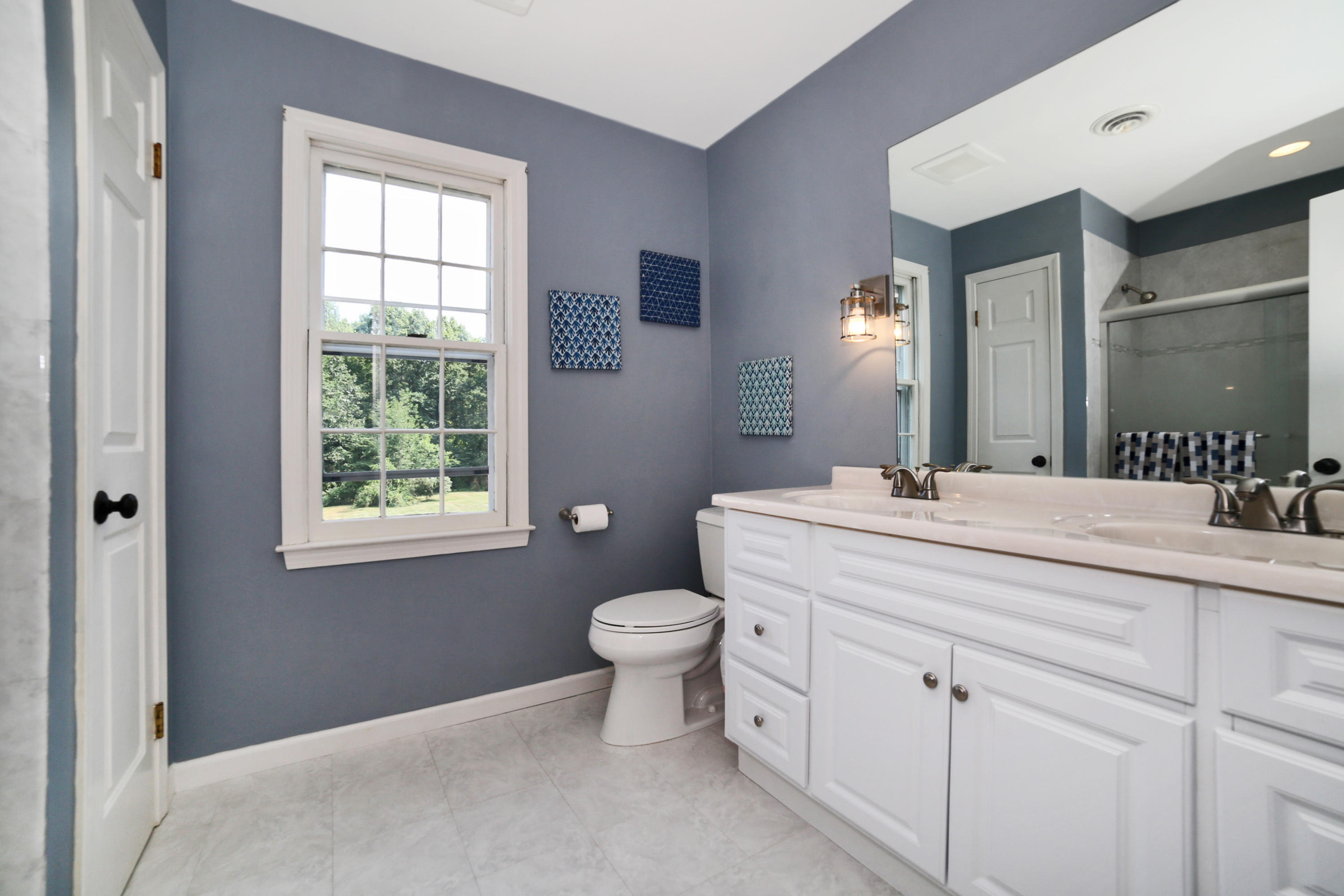 48 Hoyt Farm Road New Canaan, CT 06840 - Photo 22 of 26 a bathroom with a toilet sink and mirror