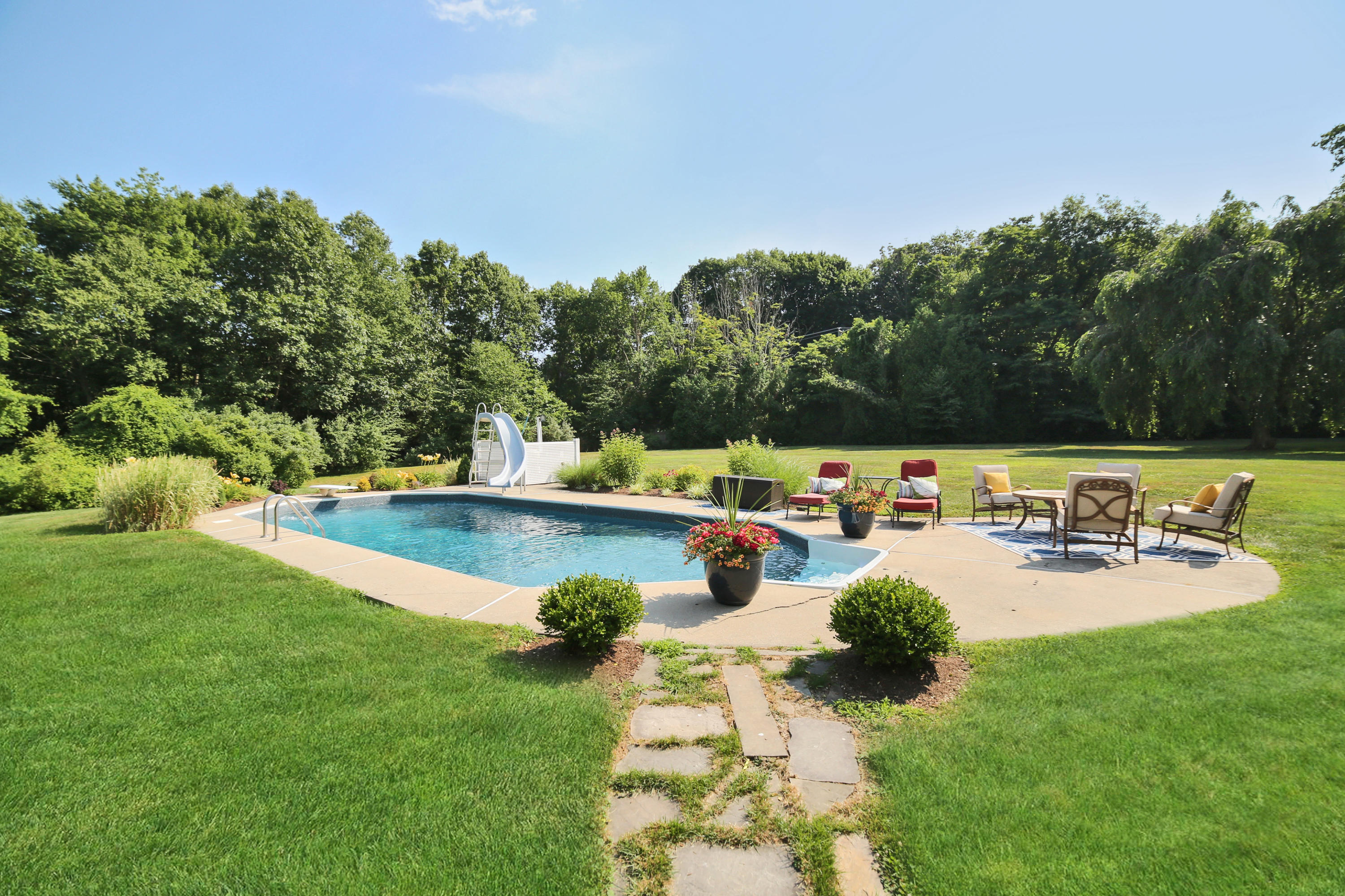 48 Hoyt Farm Road New Canaan, CT 06840 - Photo 3 of 26 a view of a swimming pool with a patio