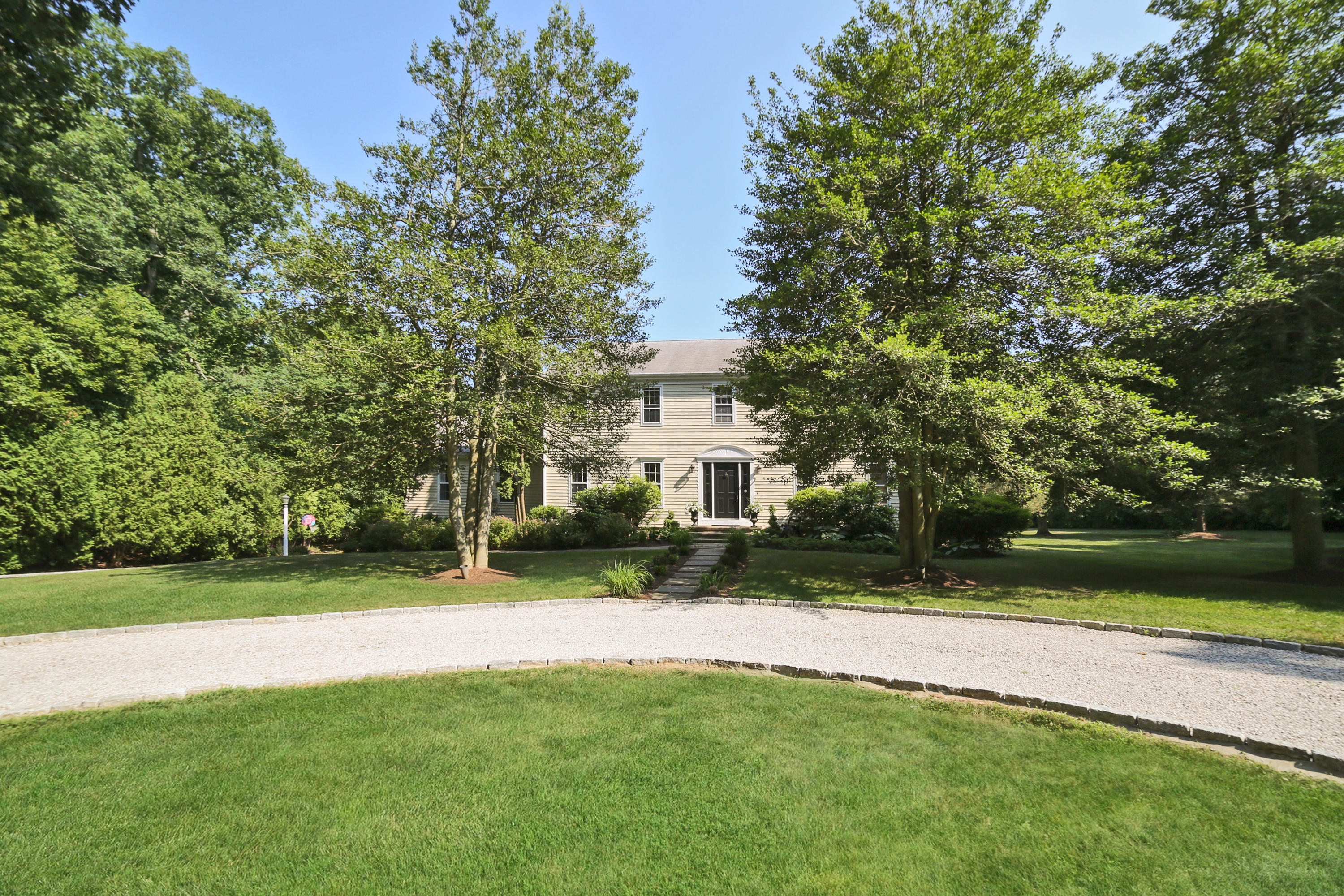 48 Hoyt Farm Road New Canaan, CT 06840 - Photo 4 of 26 a view of a house with a yard and a large tree