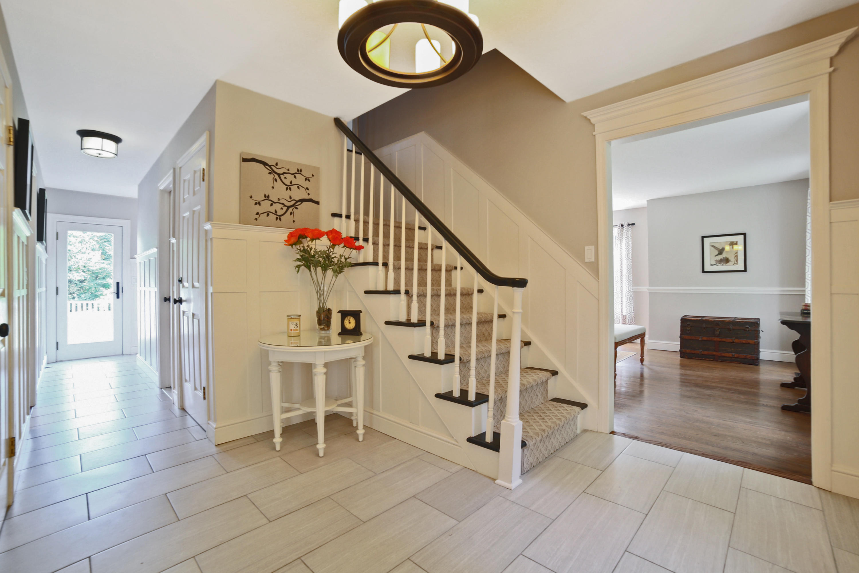 48 Hoyt Farm Road New Canaan, CT 06840 - Photo 8 of 26 a view of a livingroom with furniture and stairs