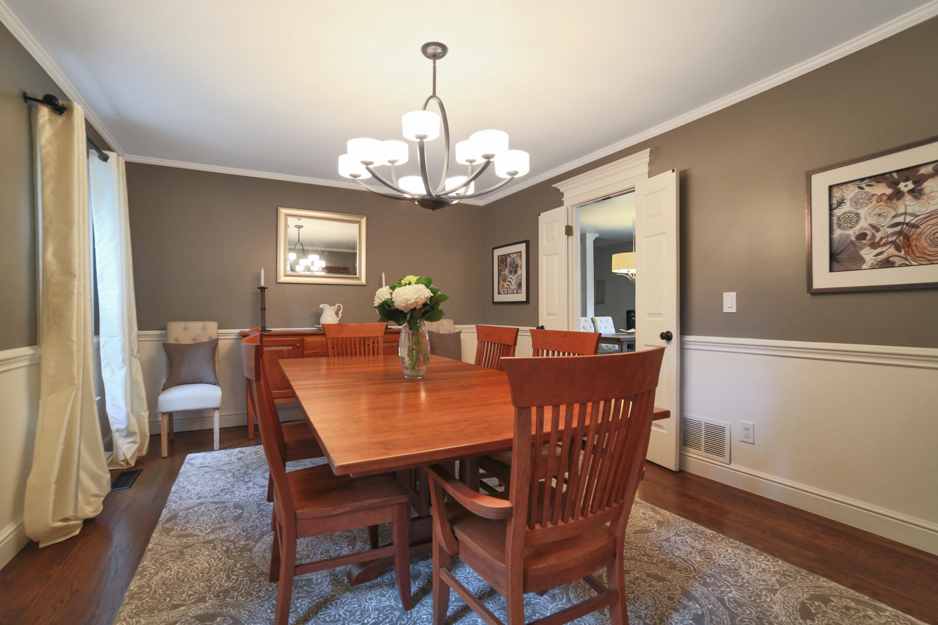 48 Hoyt Farm Road New Canaan, CT 06840 - Photo 10 of 26 a view of a dining room with furniture a chandelier and wooden floor