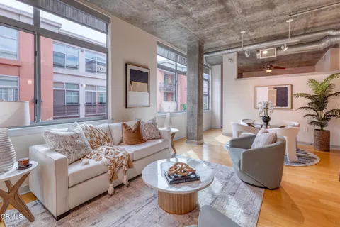 a living room with furniture and a table