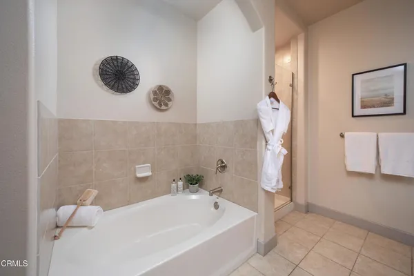a bathroom with a tub and a shower