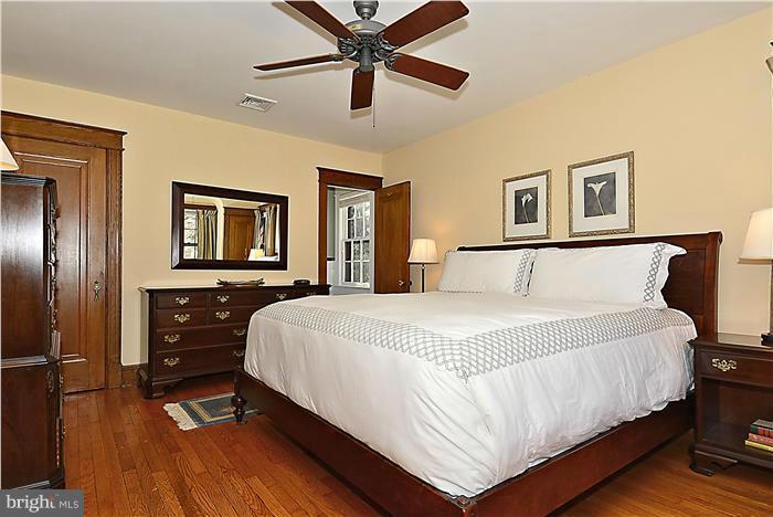 1914 Stratton Road Silver Spring, MD 20910 - Photo 7 of 13 a bedroom with a bed and wooden floor