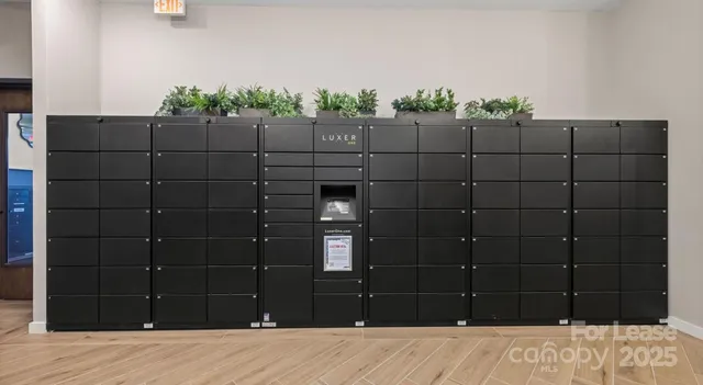 a view of a a dining room with furniture window and wooden floor