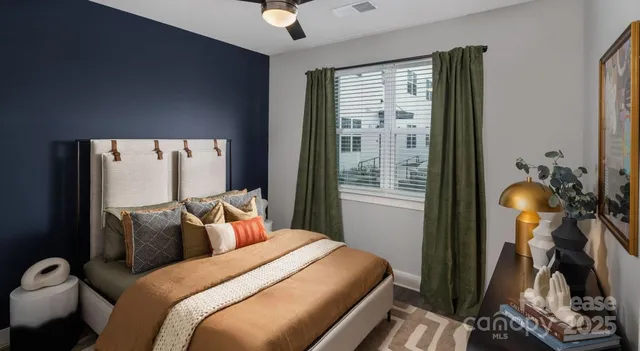 a kitchen with stainless steel appliances kitchen island granite countertop a sink a stove and refrigerator