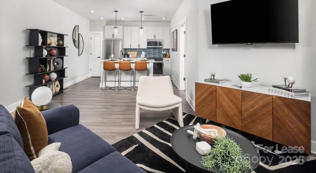 a kitchen with stainless steel appliances a sink stove and refrigerator