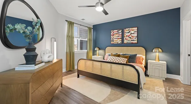 a bathroom with a sink a toilet a mirror and shower curtain