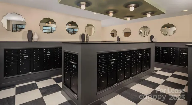 a view of a patio with a table and chairs under an umbrella