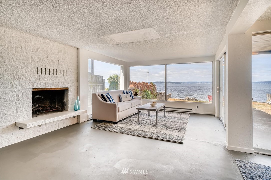 5633 Beach Drive Southwest Seattle, WA 98136 - Photo 11 of 25 a living room with furniture and a fireplace